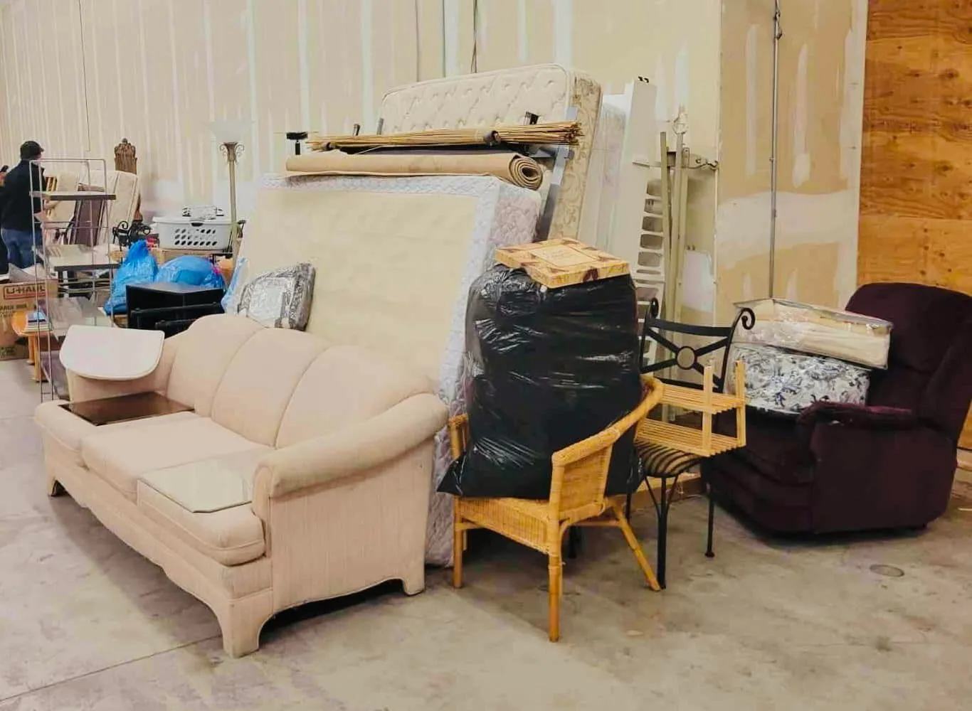 Volunteers standing together next to collected furniture